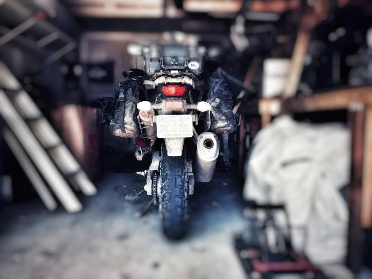 A blurry photo of a motorcycle stored in a garage