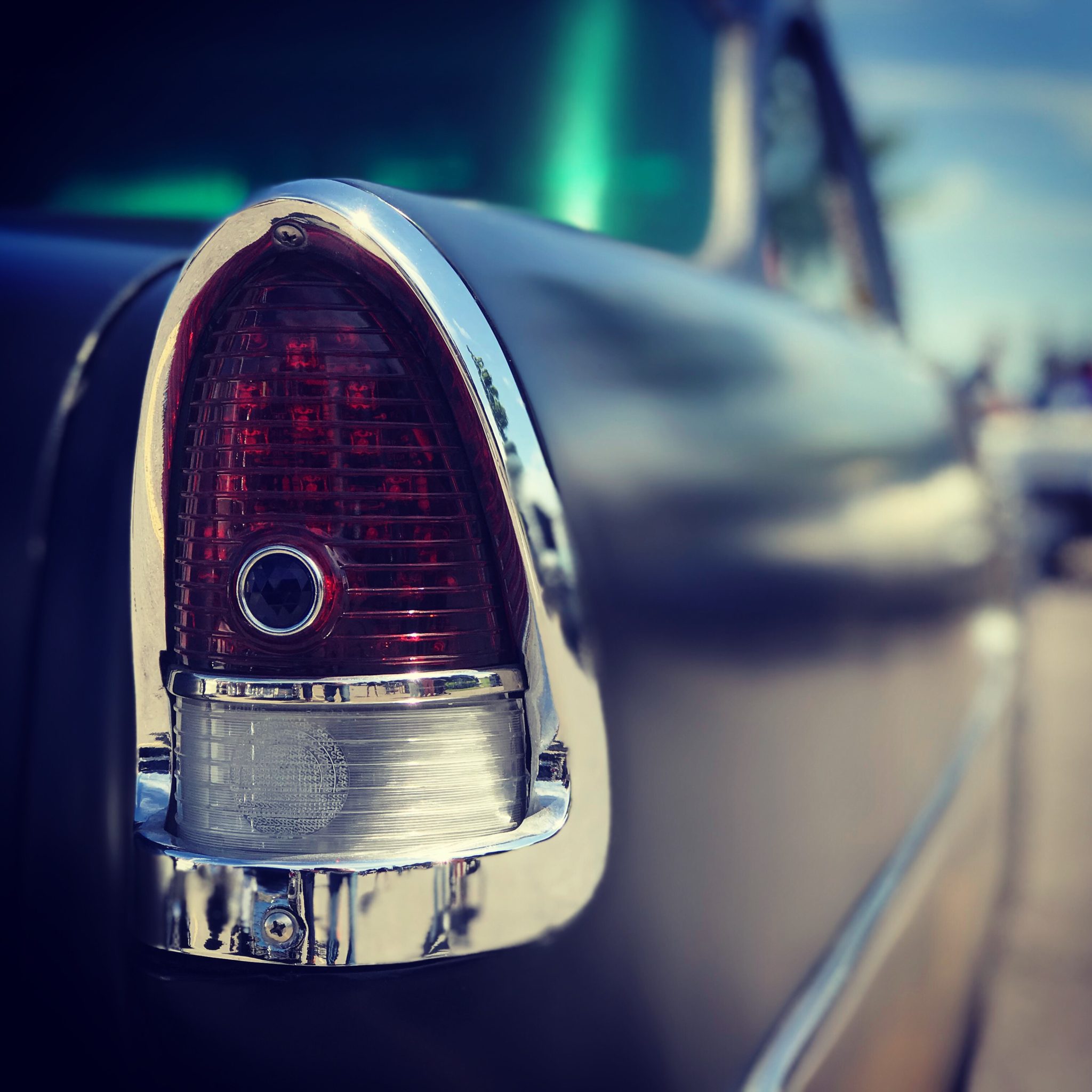 Photo of the tail light of a 55 Chevy