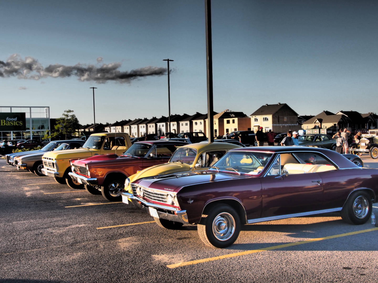 a photo of several classic muscle cars from the 1960's and 1970's taken at Kemptville Cruise Nights