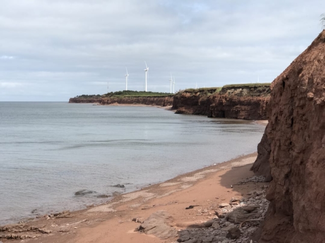 The beach and some wind turbines at North Cape PEI