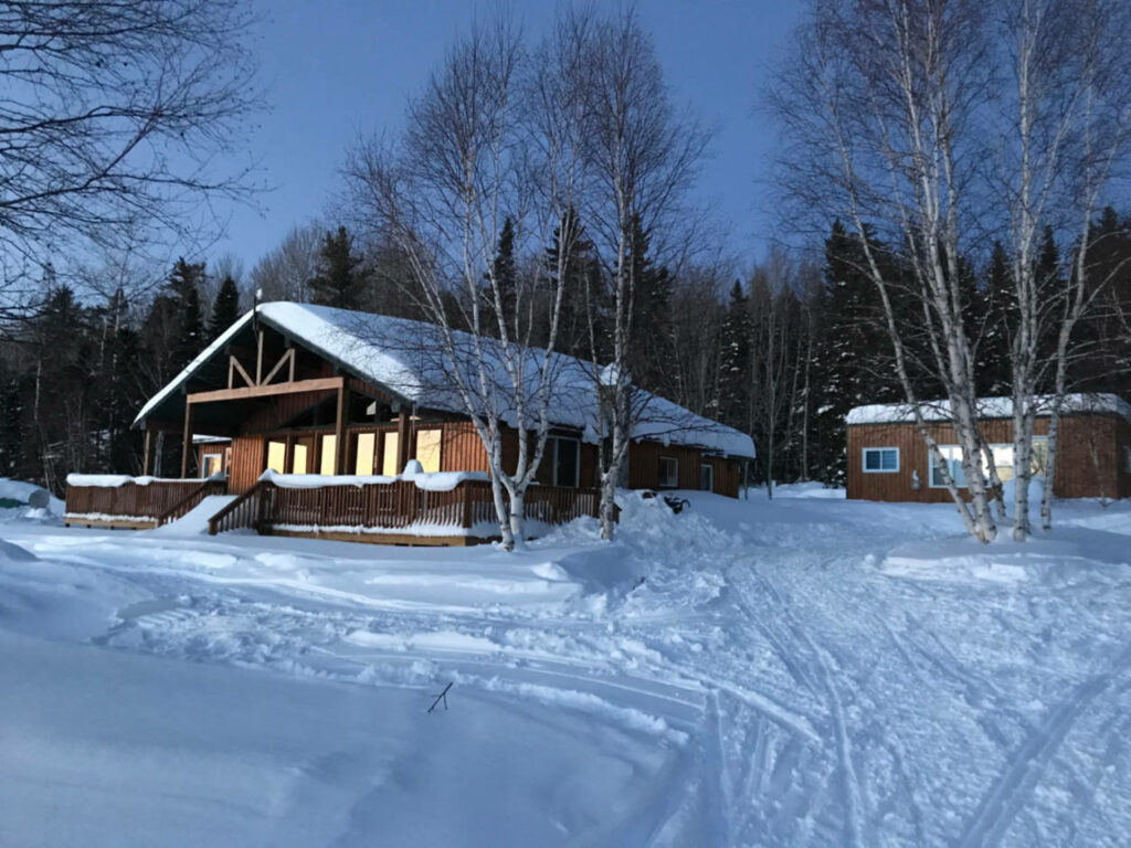 a photo of a winter scene of a chalet in Wawa Ontario