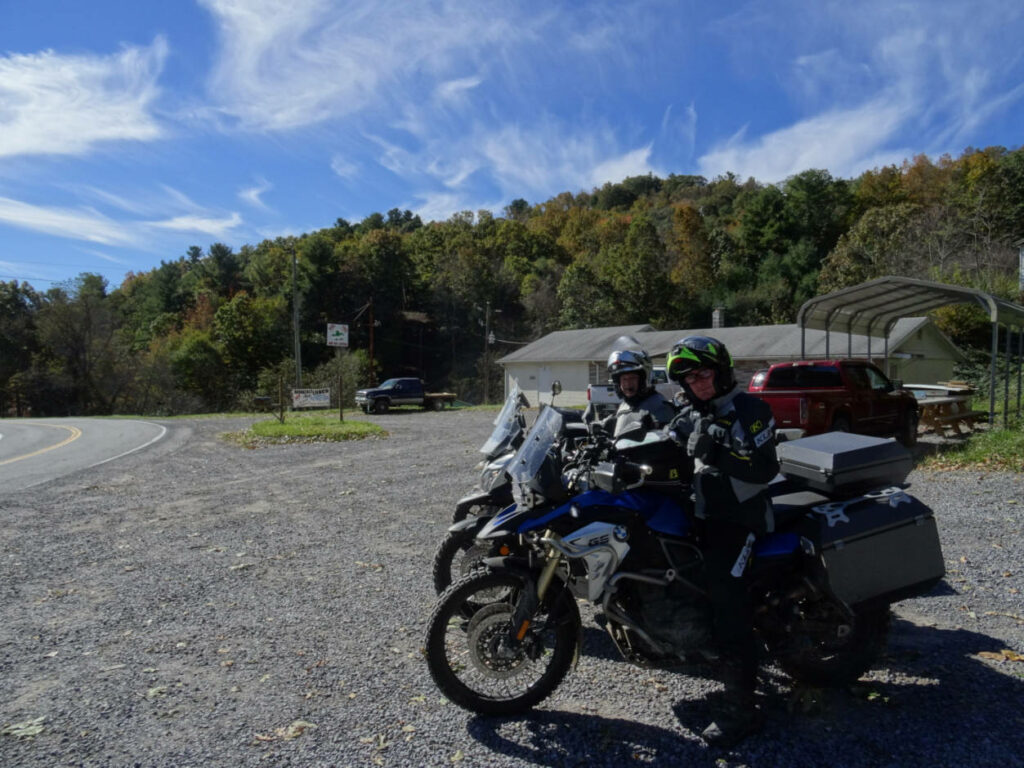 a photo of 2 motorcycle riders astride their bikes