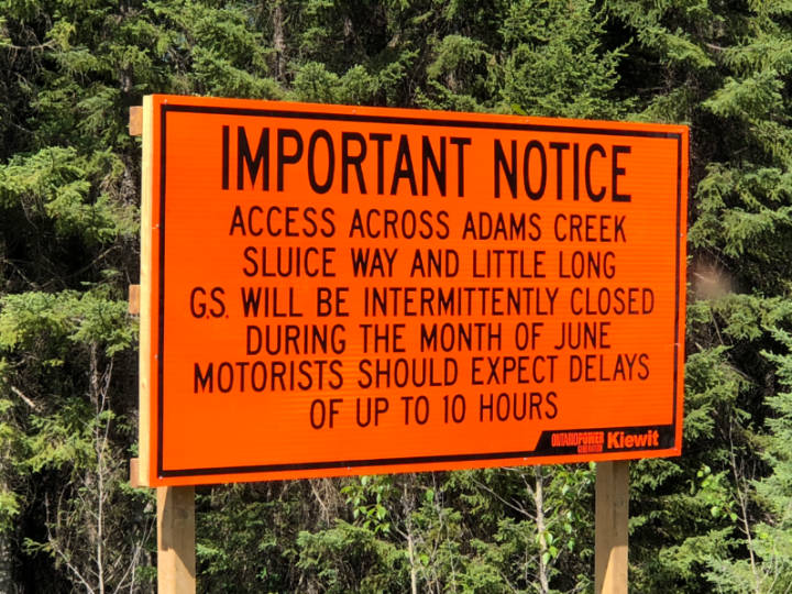 A photo of a large construction sign advising of road closures and delays ahead